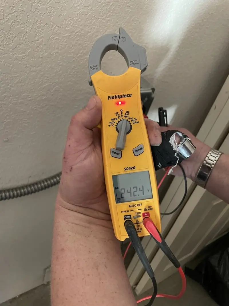 Voltage testing with clamp meter during Generator Installation in Princeton